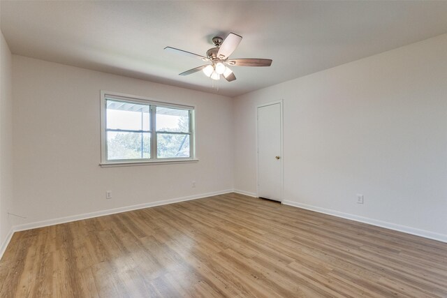 unfurnished bedroom with a ceiling fan, baseboards, visible vents, and light wood finished floors