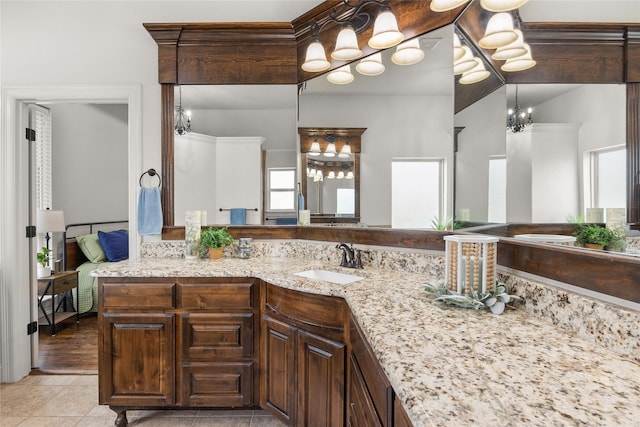 full bathroom with vanity and tile patterned floors