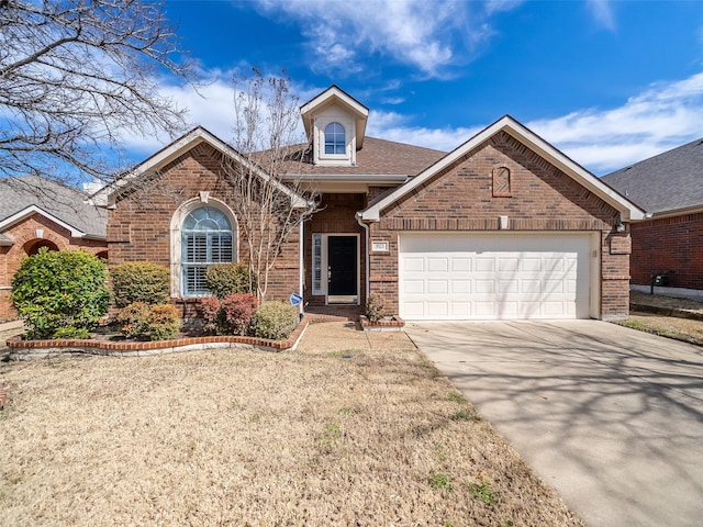 ranch-style home with an attached garage, roof with shingles, concrete driveway, and brick siding