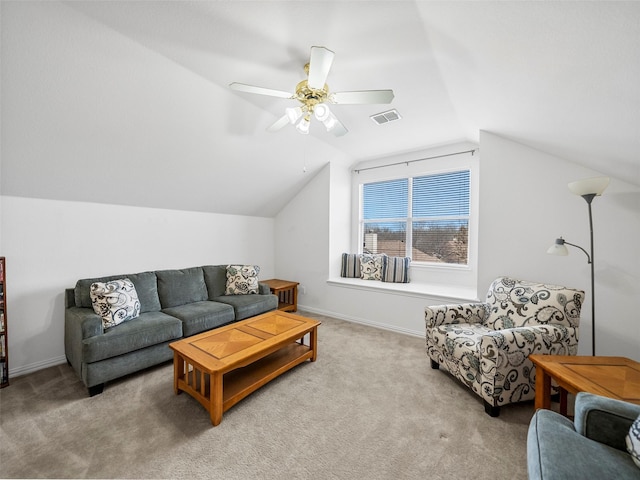 carpeted living room featuring a ceiling fan, lofted ceiling, visible vents, and baseboards