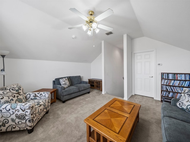 living area with carpet floors, visible vents, vaulted ceiling, and ceiling fan