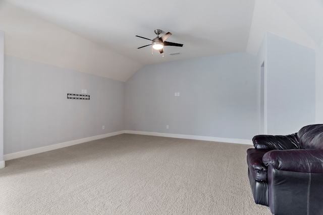 living area with carpet, lofted ceiling, visible vents, ceiling fan, and baseboards