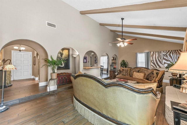 living room with arched walkways, dark wood-style flooring, visible vents, beamed ceiling, and ceiling fan with notable chandelier