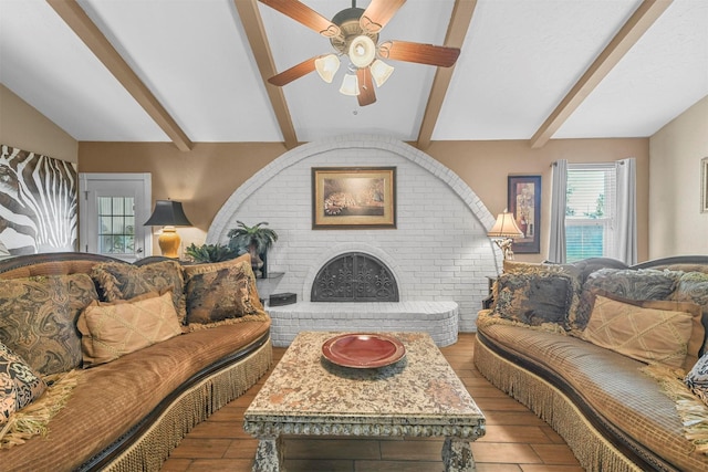 living room with lofted ceiling with beams, ceiling fan, a fireplace, and light wood-style floors