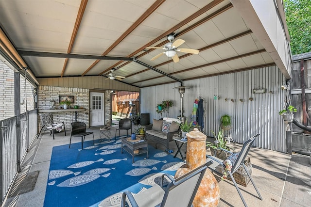 view of patio / terrace with ceiling fan and an outdoor living space