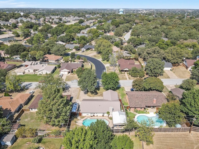 birds eye view of property with a residential view