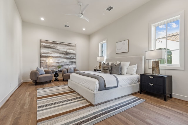 bedroom featuring light wood finished floors, baseboards, visible vents, a ceiling fan, and recessed lighting