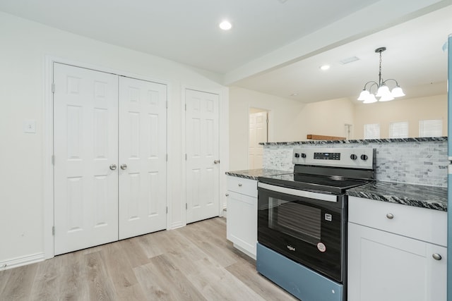 kitchen featuring white cabinets, stainless steel electric range oven, light wood-type flooring, pendant lighting, and backsplash