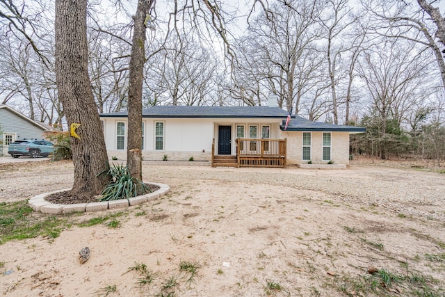 ranch-style house featuring a chimney