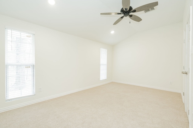 unfurnished room featuring lofted ceiling, ceiling fan, recessed lighting, light colored carpet, and baseboards