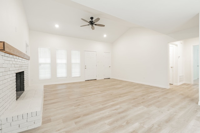 1345 Tawakoni Dr, West Tawakoni, TX 75474 - unfurnished living room featuring a ceiling fan, light wood-style flooring, and a fireplace