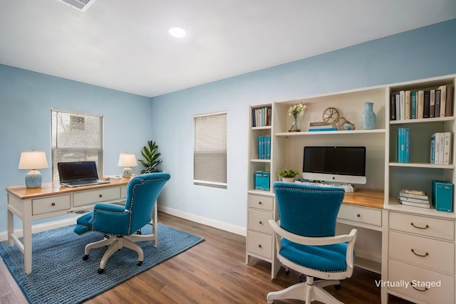 office area featuring dark wood-type flooring and baseboards