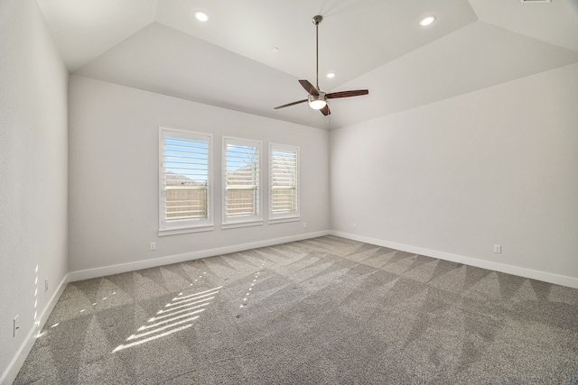 carpeted spare room featuring vaulted ceiling, ceiling fan, recessed lighting, and baseboards