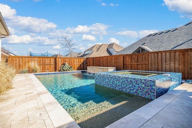 view of swimming pool with a fenced in pool, a fenced backyard, and an in ground hot tub