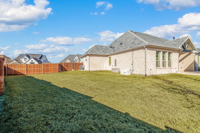 view of yard with a fenced backyard