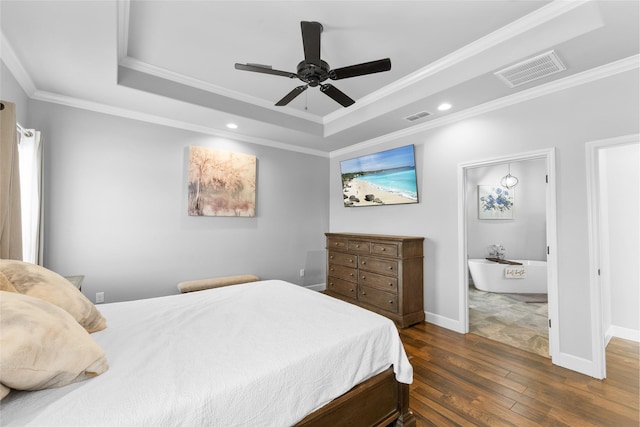 bedroom featuring visible vents, a raised ceiling, and dark wood finished floors