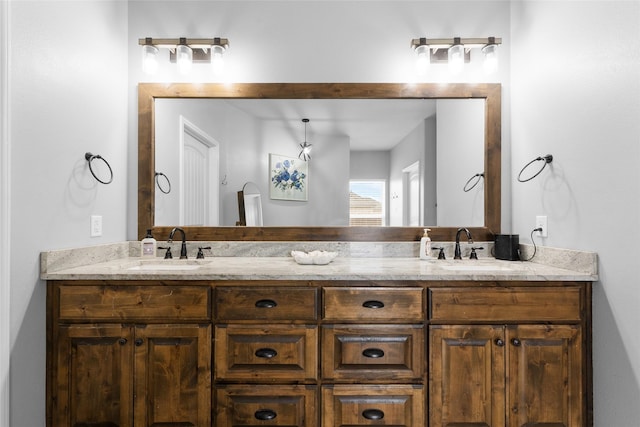 full bathroom with double vanity and a sink