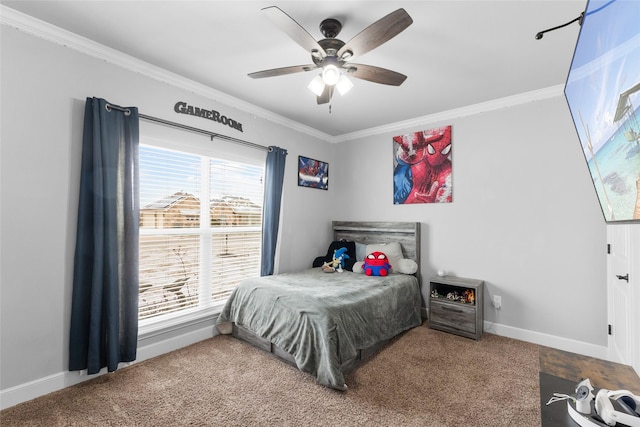 carpeted bedroom with baseboards, ceiling fan, and crown molding