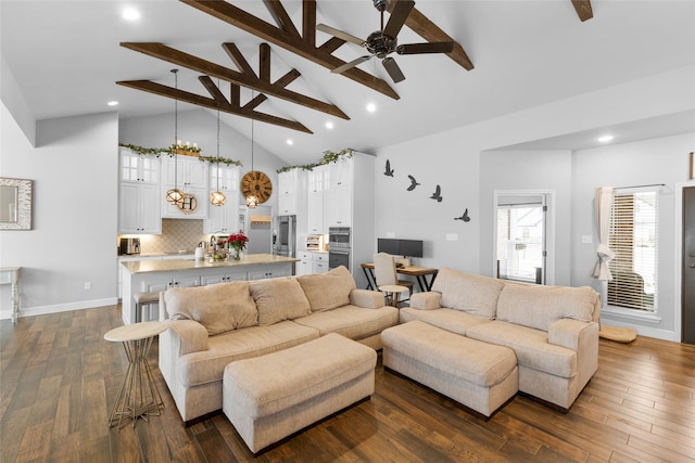 living room featuring high vaulted ceiling, dark wood-style flooring, beam ceiling, and baseboards