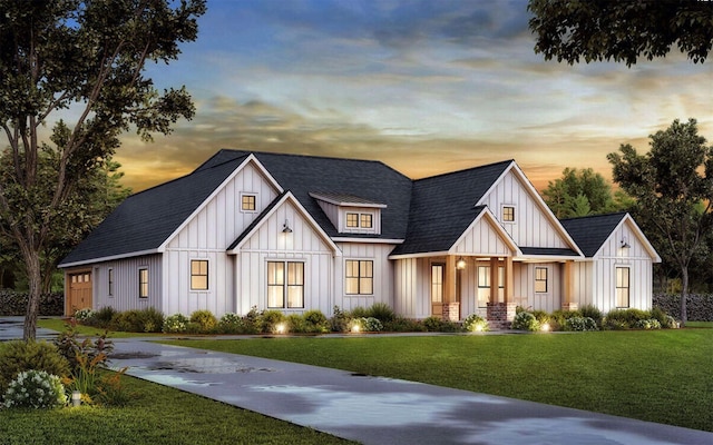 modern inspired farmhouse with concrete driveway, roof with shingles, board and batten siding, and a yard