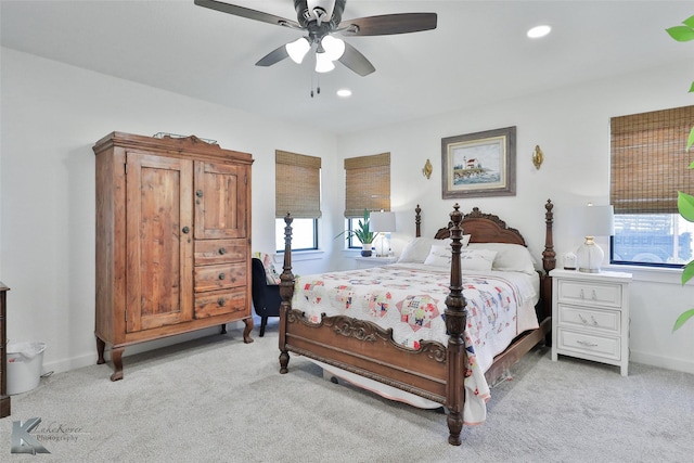 bedroom with light carpet, baseboards, a ceiling fan, and recessed lighting