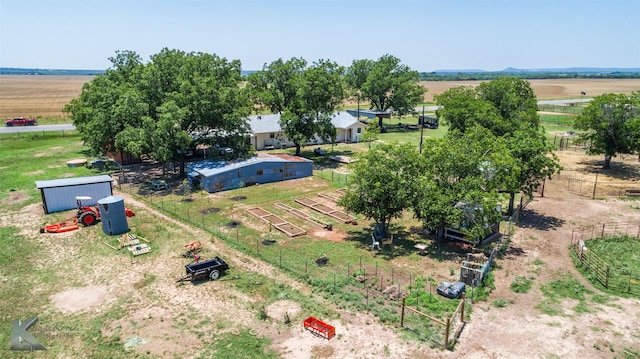 birds eye view of property with a rural view