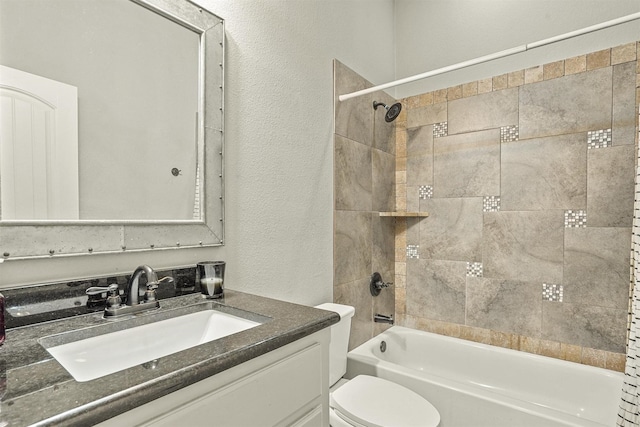 8500 Cobble Stone, Godley, TX 76044 - bathroom with a textured wall, vanity, tub / shower combination, and toilet