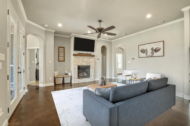 8500 Cobble Stone, Godley, TX 76044 - living area featuring arched walkways, recessed lighting, a stone fireplace, ornamental molding, and baseboards