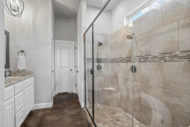 bathroom featuring vanity, concrete flooring, and a stall shower