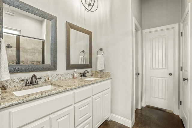8500 Cobble Stone, Godley, TX 76044 - full bathroom featuring baseboards, double vanity, concrete flooring, and tiled shower