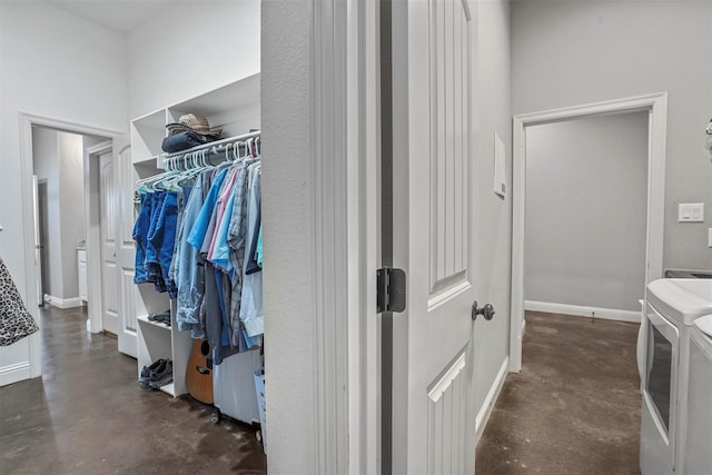 spacious closet featuring washer and dryer