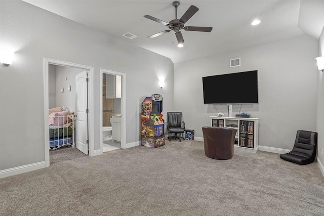 interior space featuring ceiling fan, visible vents, baseboards, and carpet