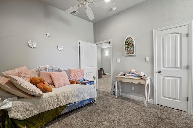 carpeted bedroom with visible vents, a ceiling fan, and lofted ceiling