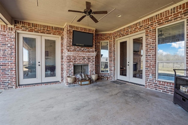 view of patio with french doors and ceiling fan