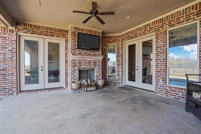 8500 Cobble Stone, Godley, TX 76044 - view of patio / terrace with french doors, a ceiling fan, and an outdoor brick fireplace