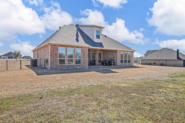 8500 Cobble Stone, Godley, TX 76044 - rear view of house featuring brick siding, a shingled roof, and a patio