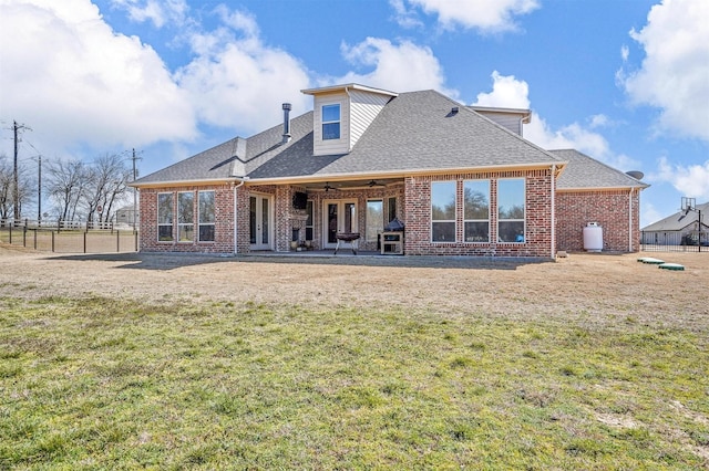 8500 Cobble Stone, Godley, TX 76044 - back of property featuring a shingled roof, brick siding, french doors, ceiling fan, and a patio area