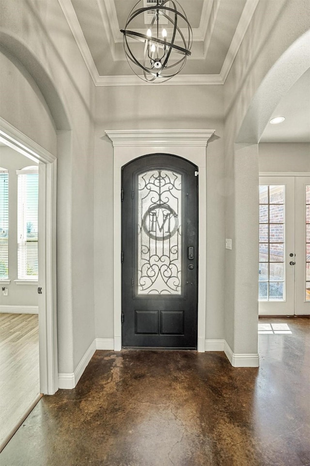 8500 Cobble Stone, Godley, TX 76044 - entryway featuring finished concrete floors, a chandelier, baseboards, arched walkways, and crown molding