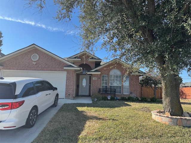 ranch-style home with brick siding, an attached garage, a front yard, fence, and driveway