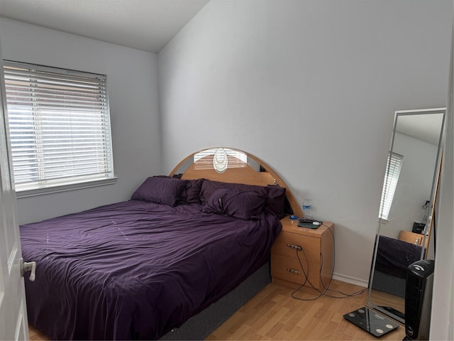 bedroom featuring light wood-style floors