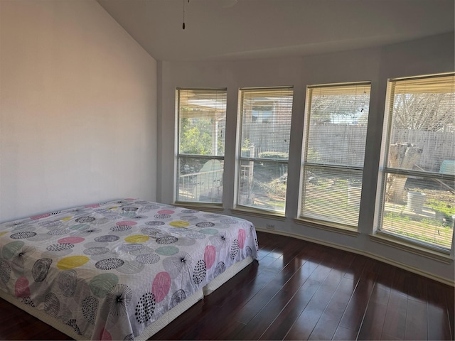 bedroom with hardwood / wood-style flooring