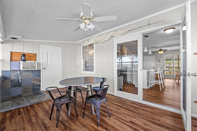 dining room with visible vents, wood finished floors, and a ceiling fan