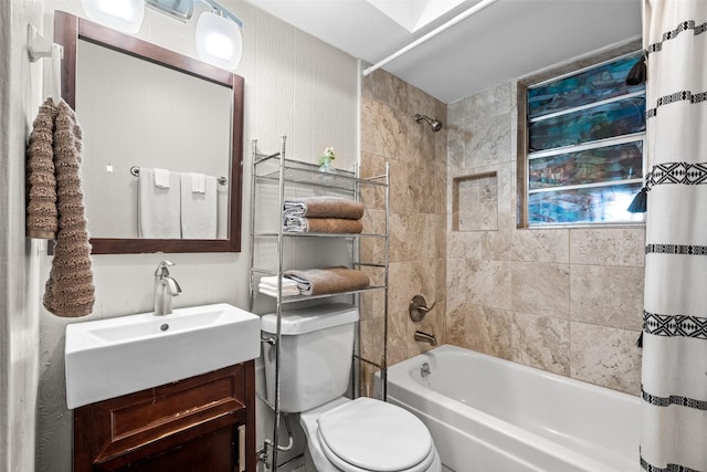 full bathroom featuring shower / bath combination with curtain, vanity, and toilet