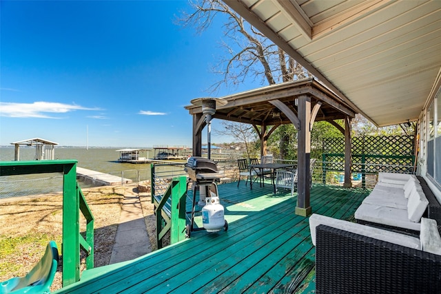 wooden deck with a gazebo and a water view