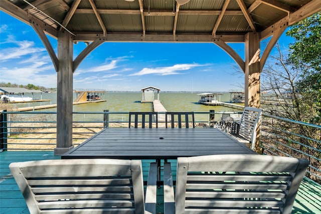 wooden deck with a gazebo and a water view