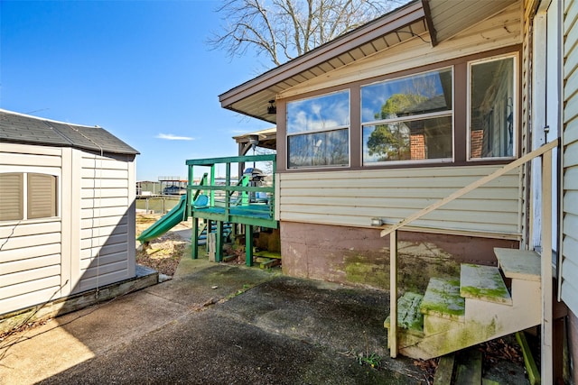 view of property exterior featuring a playground