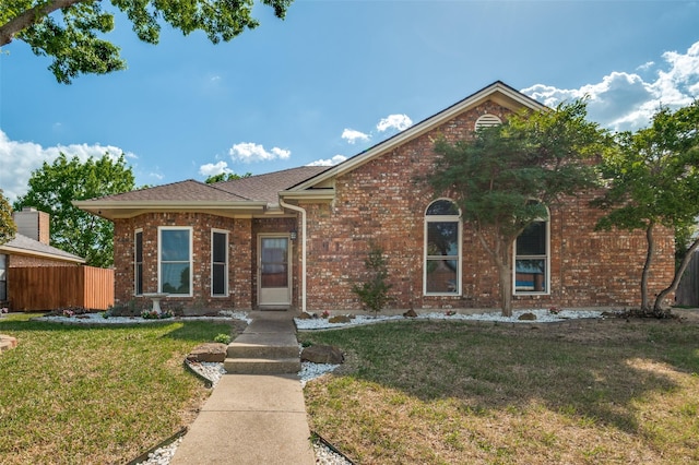 view of front of house with brick siding