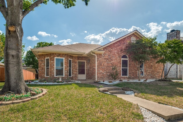 single story home with brick siding and a shingled roof