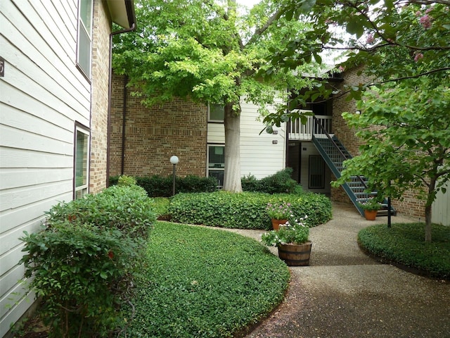 view of yard featuring stairs