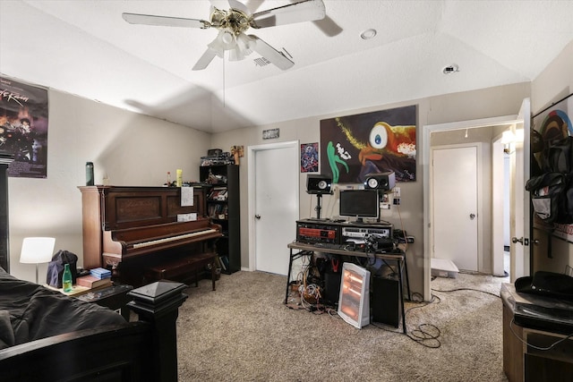 interior space with carpet, visible vents, vaulted ceiling, and ceiling fan